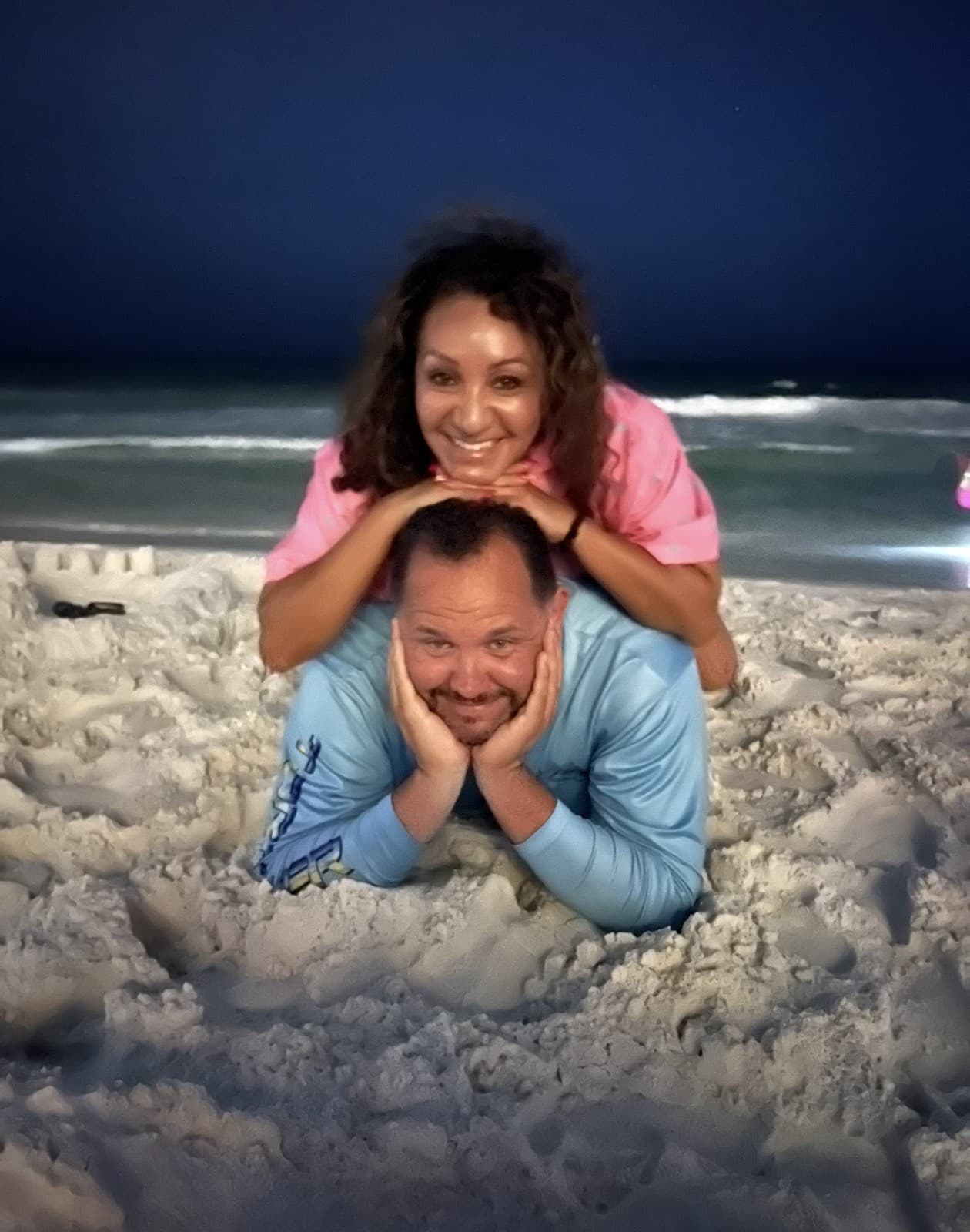 Jason and Maria on the beach at night